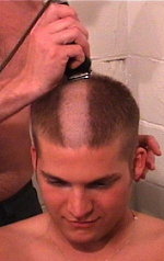 Picture of a recruit getting his head shaved